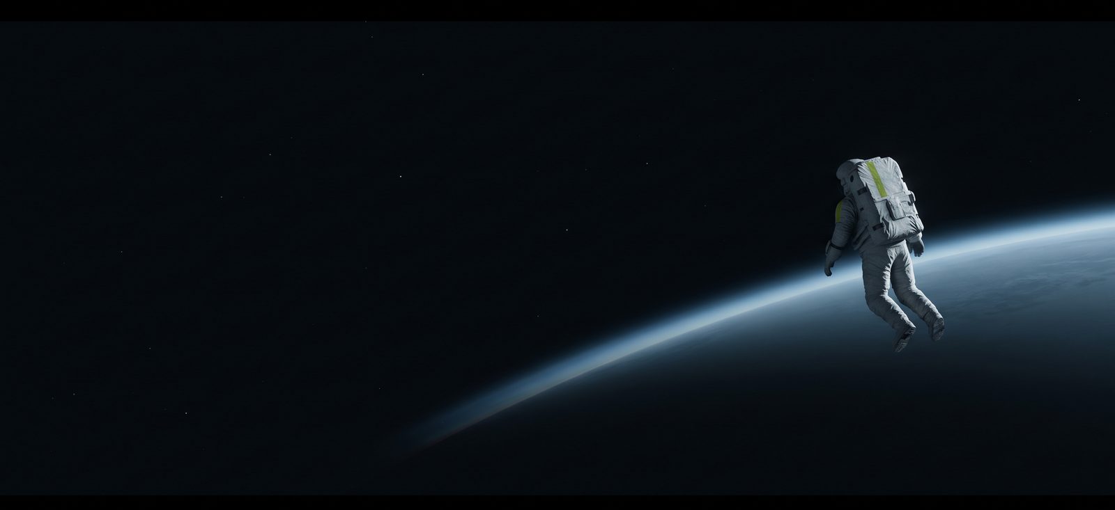 An astronaut in orbit above a distant planet, its atmosphere lit along the horizon